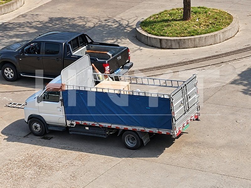 The wooden case shipment loaded onto a truck for dispatch.png